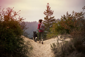 Woman hiking in the wild in outdoor apparel